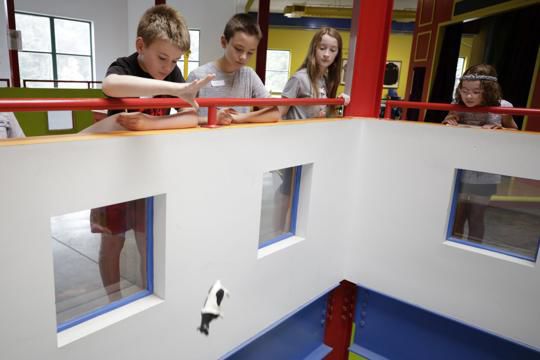 Parachutes fly in the Children's Museum of Illinois for the Lunar Landing STEAM program